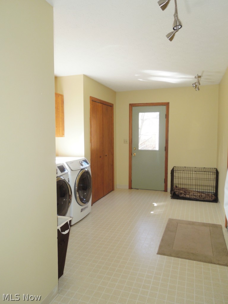 3824 Greentree Road Stow, OH 44224 - Photo 12 of 24 First floor laundry/mudroom area. Door ahead leads to back of house. There also is a door on the right that you can't see that leads to 2 car attached garage.
