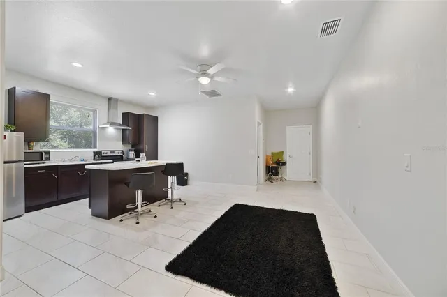 a kitchen with a refrigerator and a sink