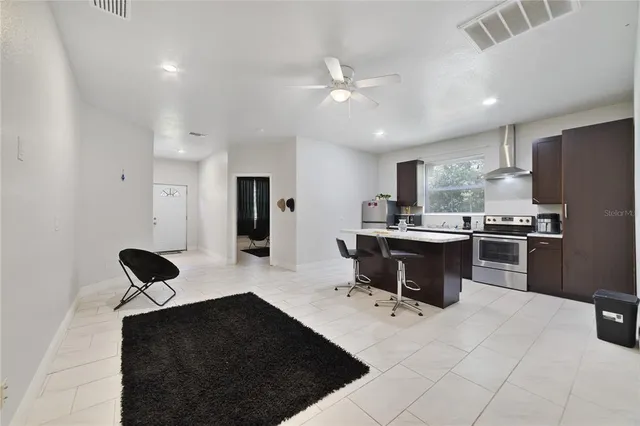 a kitchen with a refrigerator and a sink