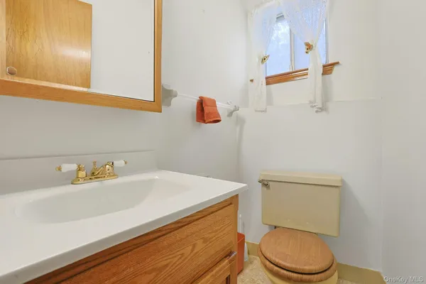a kitchen with granite countertop white cabinets and stainless steel appliances