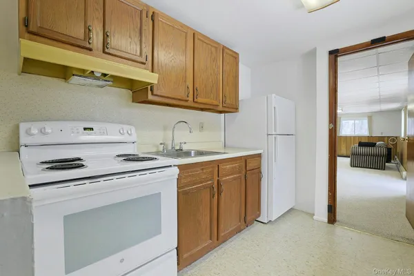 a living room with furniture and a book shelf