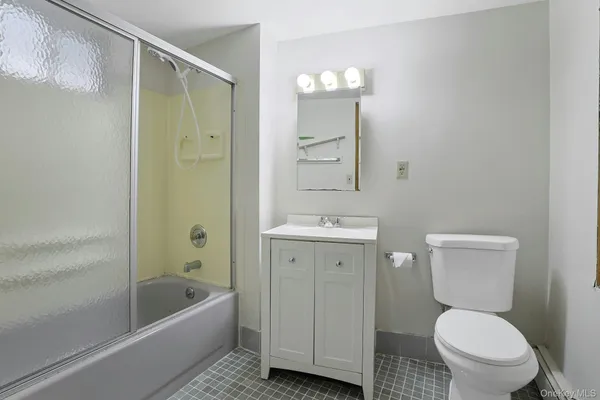 a bathroom with a toilet a sink and bathtub