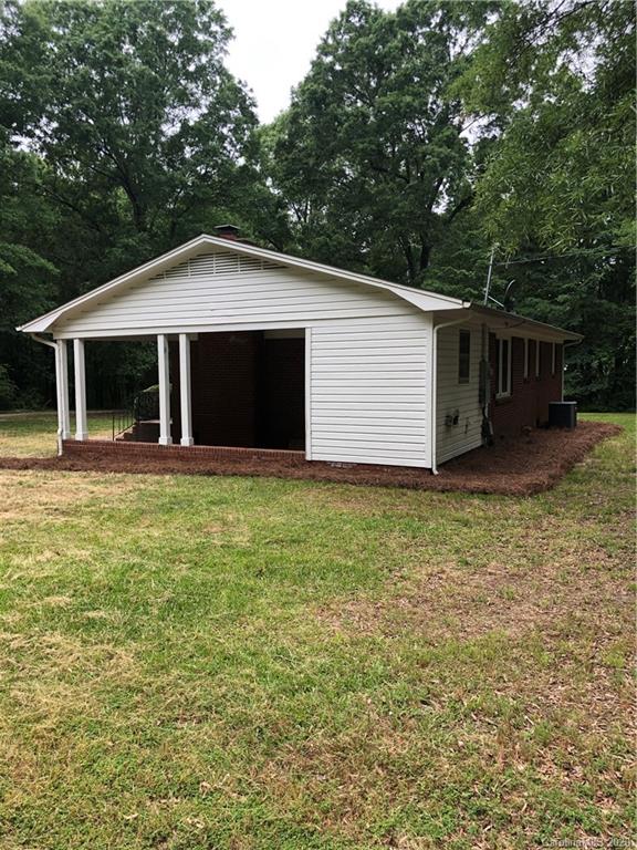 2117 White Store Road, Unit 126 Monroe, NC 28112 - Photo 18 of 20 a front view of house with yard and garage
