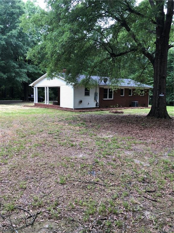 2117 White Store Road, Unit 126 Monroe, NC 28112 - Photo 20 of 20 a front view of a house with a garden