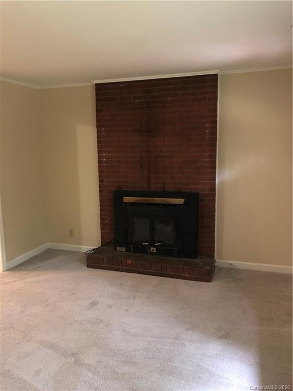 2117 White Store Road, Unit 126 Monroe, NC 28112 - Photo 8 of 20 a living room with a fireplace
