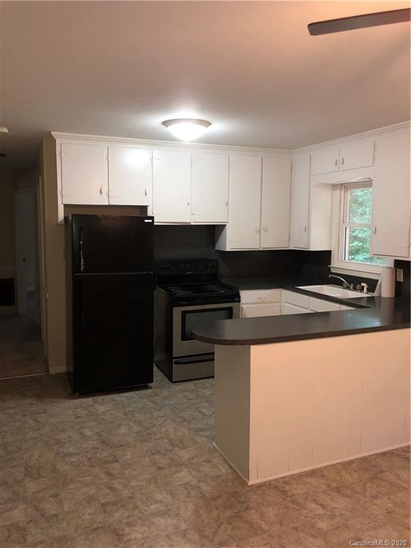 2117 White Store Road, Unit 126 Monroe, NC 28112 - Photo 9 of 20 a kitchen with a sink and cabinets