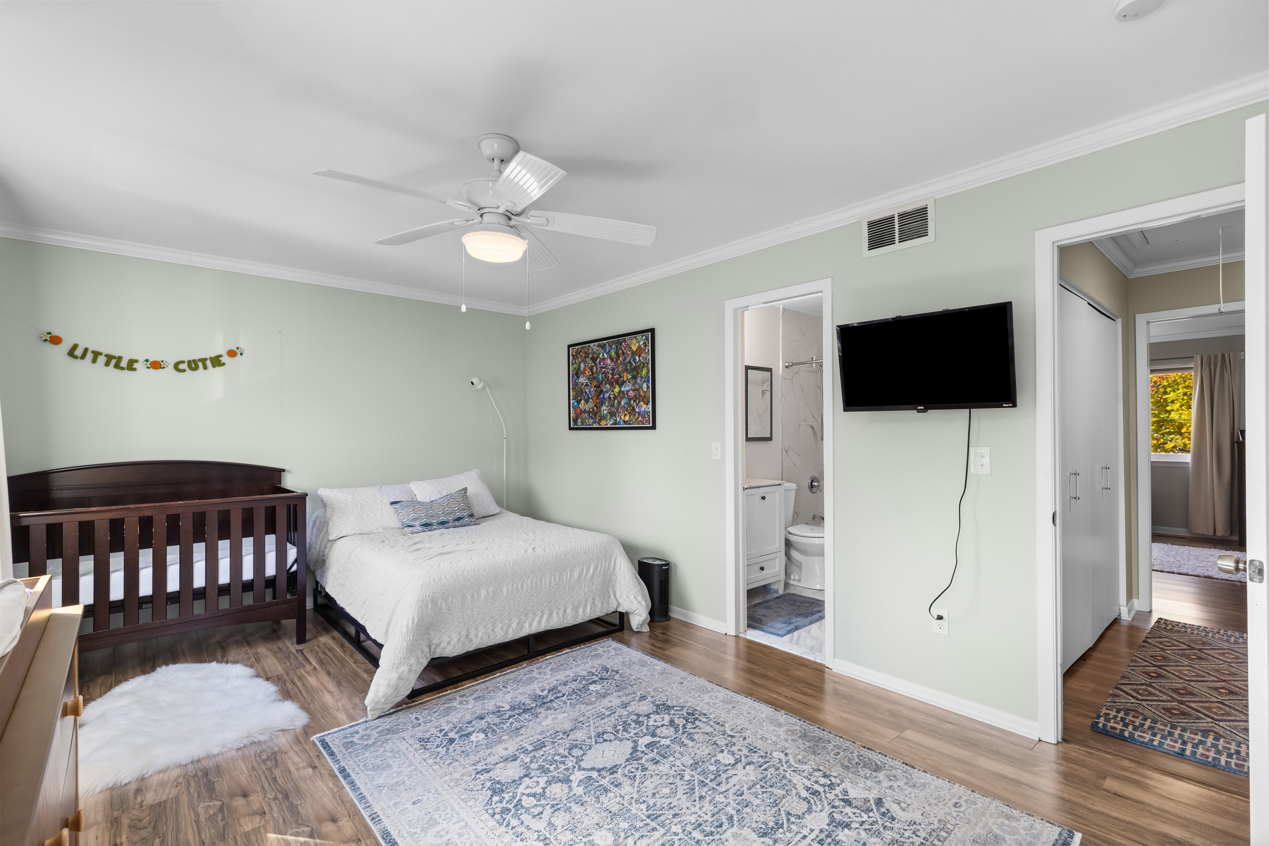 48 Randall Avenue, Unit 3 Stamford, CT 06905 - Photo 12 of 25 a spacious bedroom with a bed and a flat screen tv