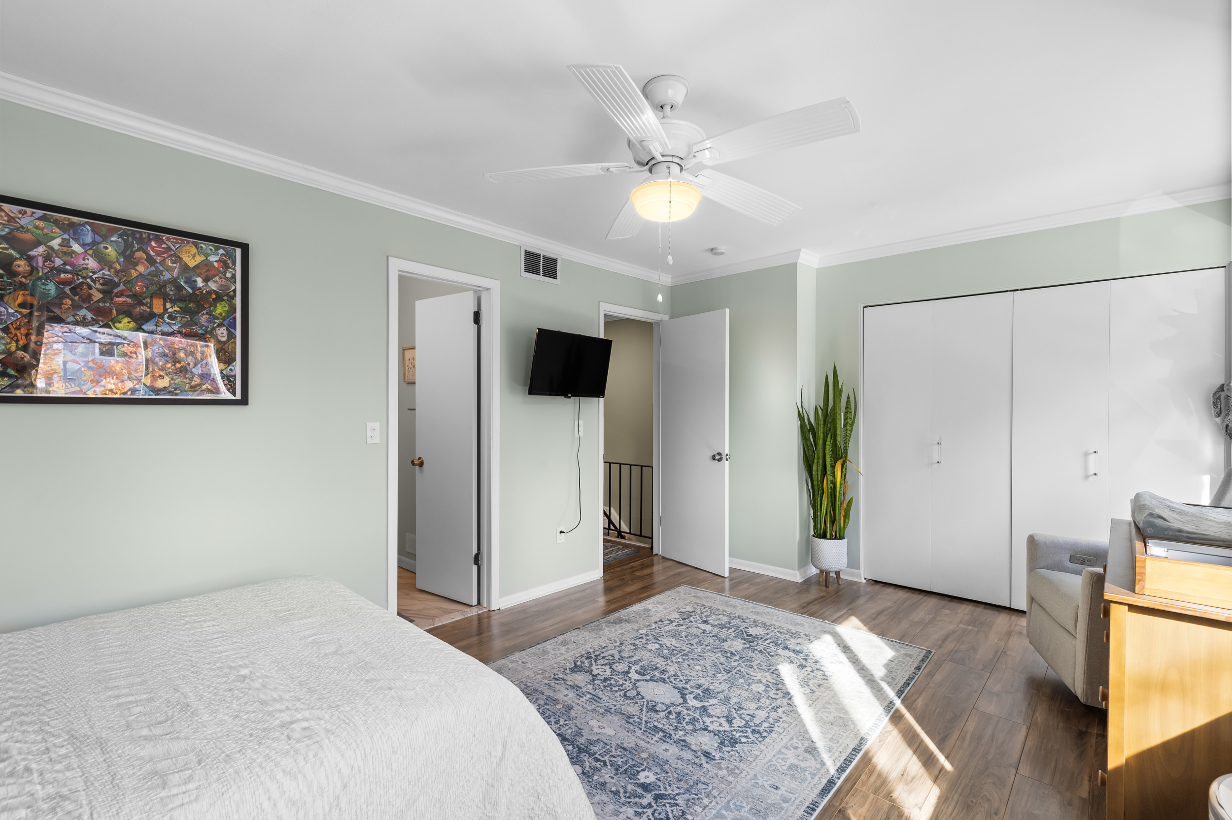 48 Randall Avenue, Unit 3 Stamford, CT 06905 - Photo 14 of 25 a bedroom with a bed and a chandelier