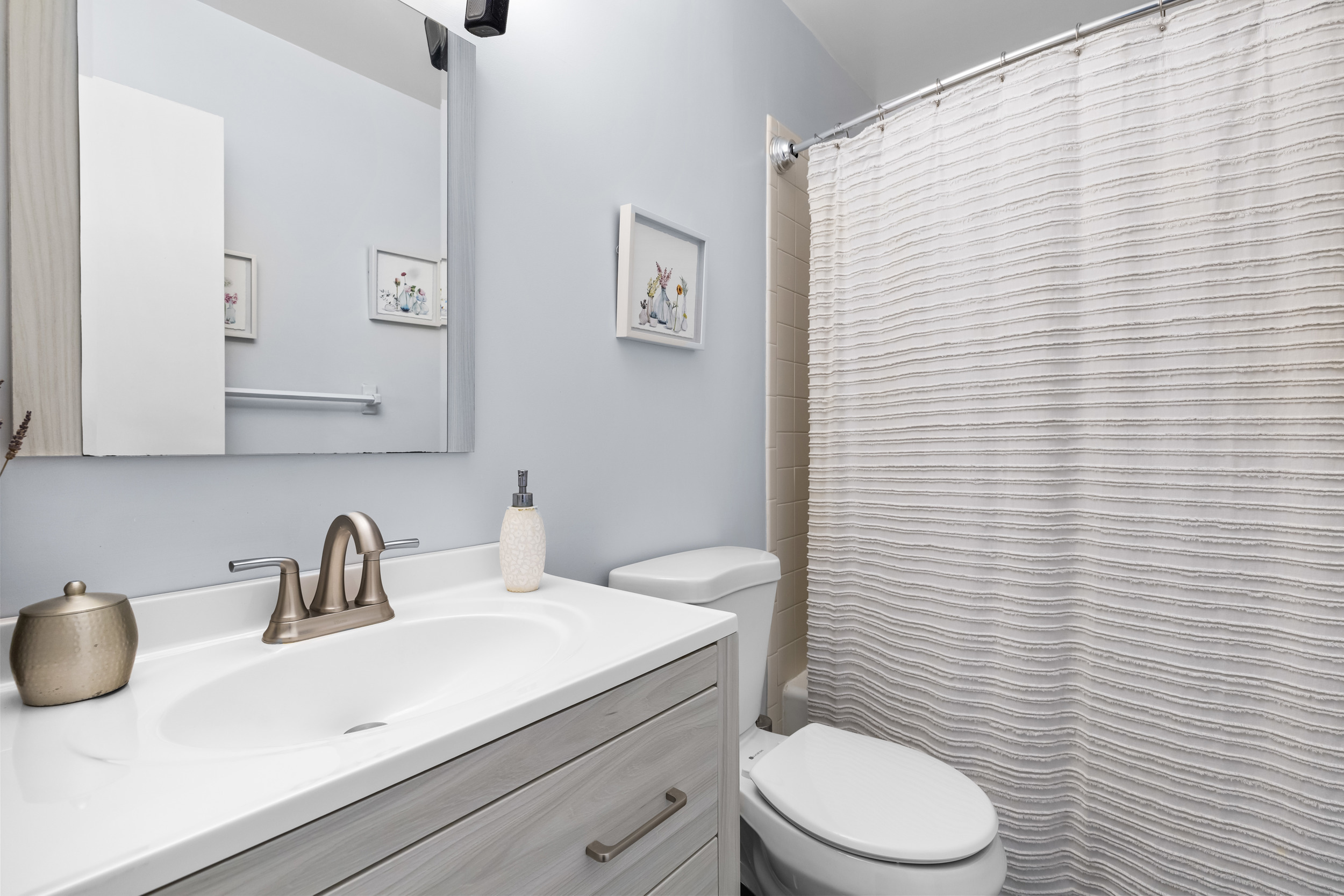 48 Randall Avenue, Unit 3 Stamford, CT 06905 - Photo 18 of 25 a bathroom with a sink a toilet and mirror