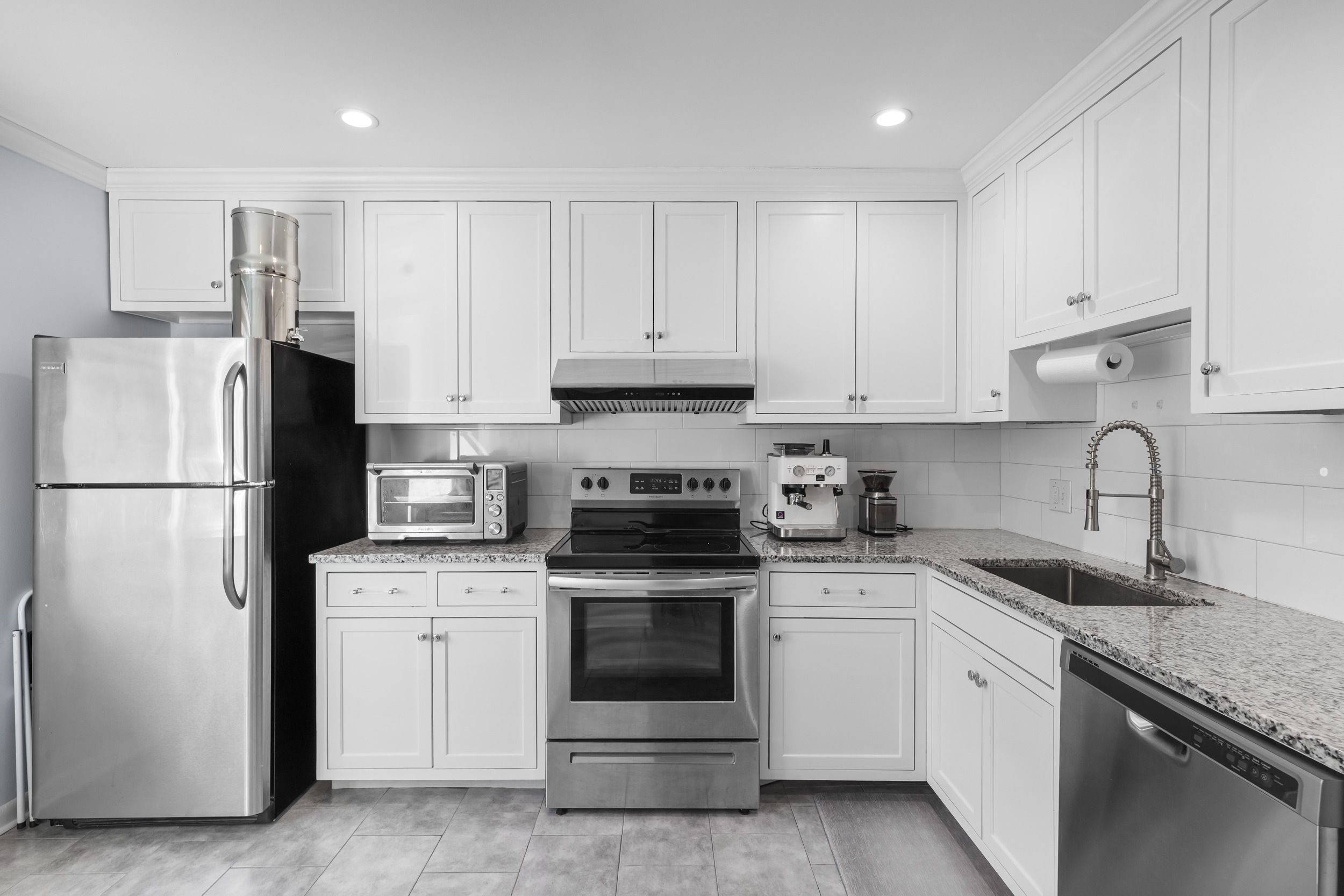 48 Randall Avenue, Unit 3 Stamford, CT 06905 - Photo 4 of 25 a kitchen with white cabinets and white appliances