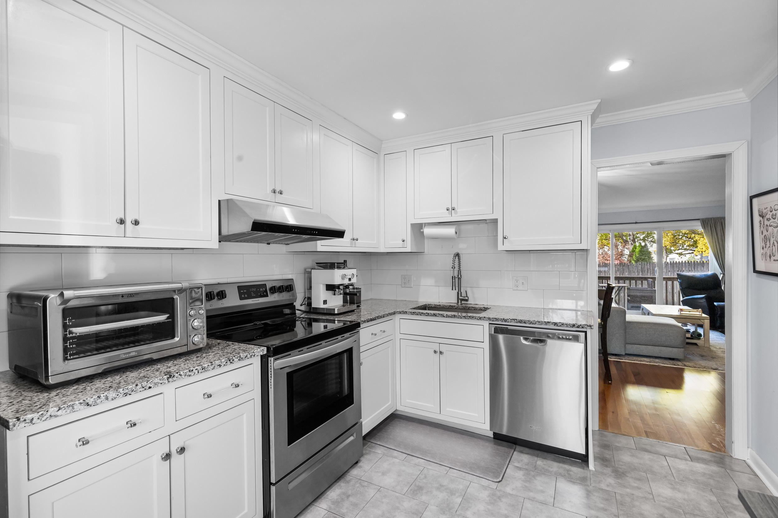 48 Randall Avenue, Unit 3 Stamford, CT 06905 - Photo 5 of 25 a kitchen with cabinets appliances and a window
