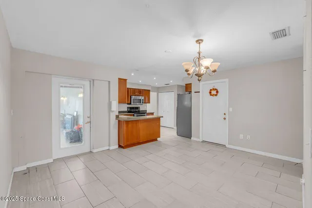 a view of an empty room with a fan