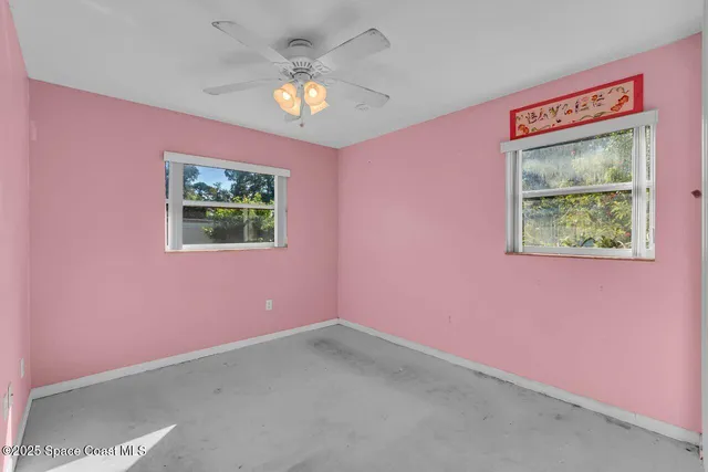 a couple of potted plants in front of door