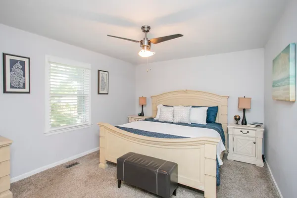 a bed room with a bed and a table