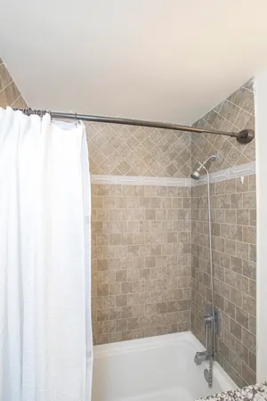 a bathroom with a shower and a bathtub