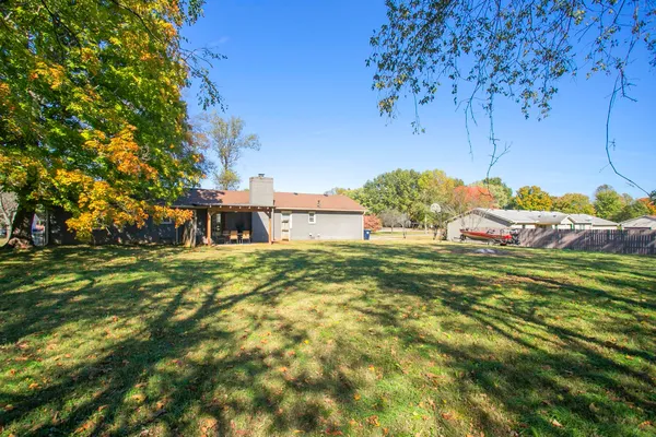 a view of a houses with a yard