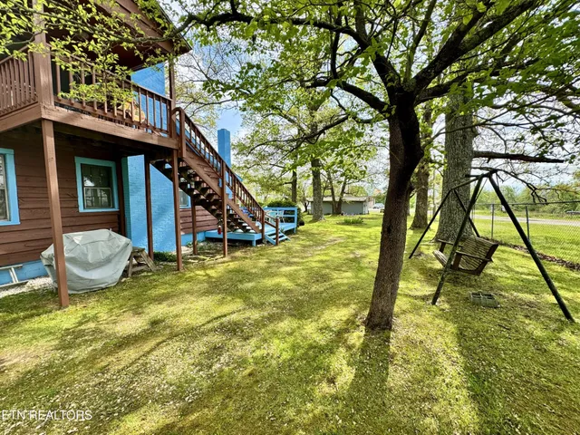a room with fireplace furniture and a flat screen tv