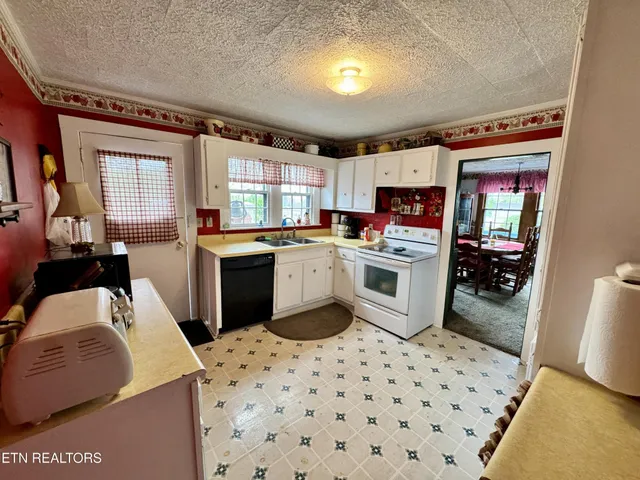 a bedroom with a bed dresser and a window