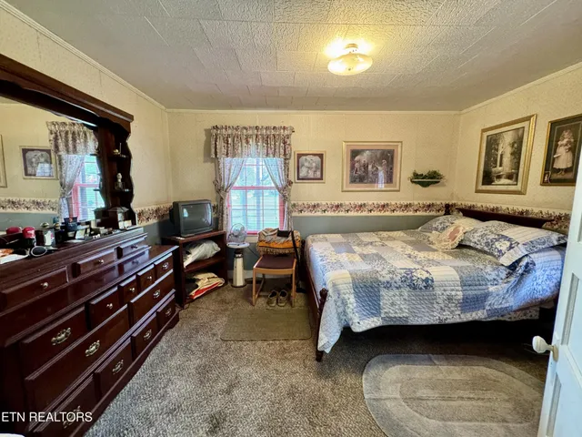 a view of balcony with furniture and wooden floor