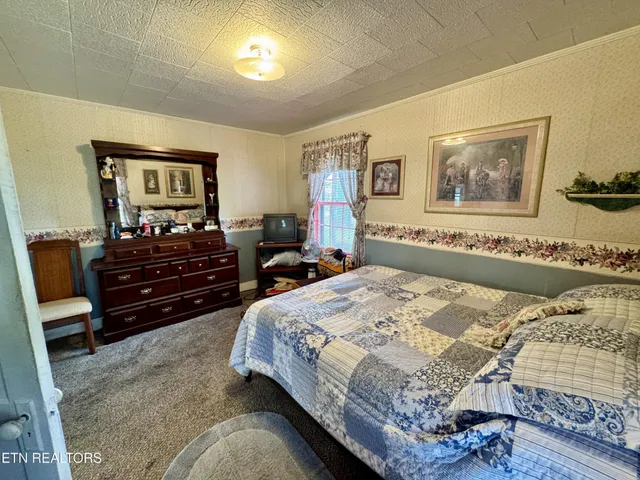 a view of balcony with wooden floor and outdoor seating
