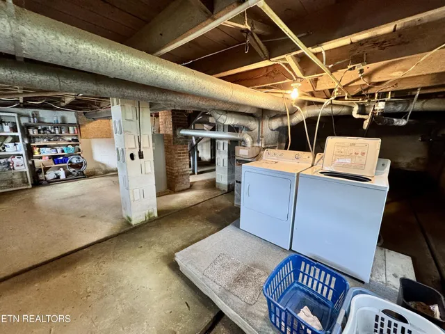 an aerial view of a residential houses with outdoor space and street view