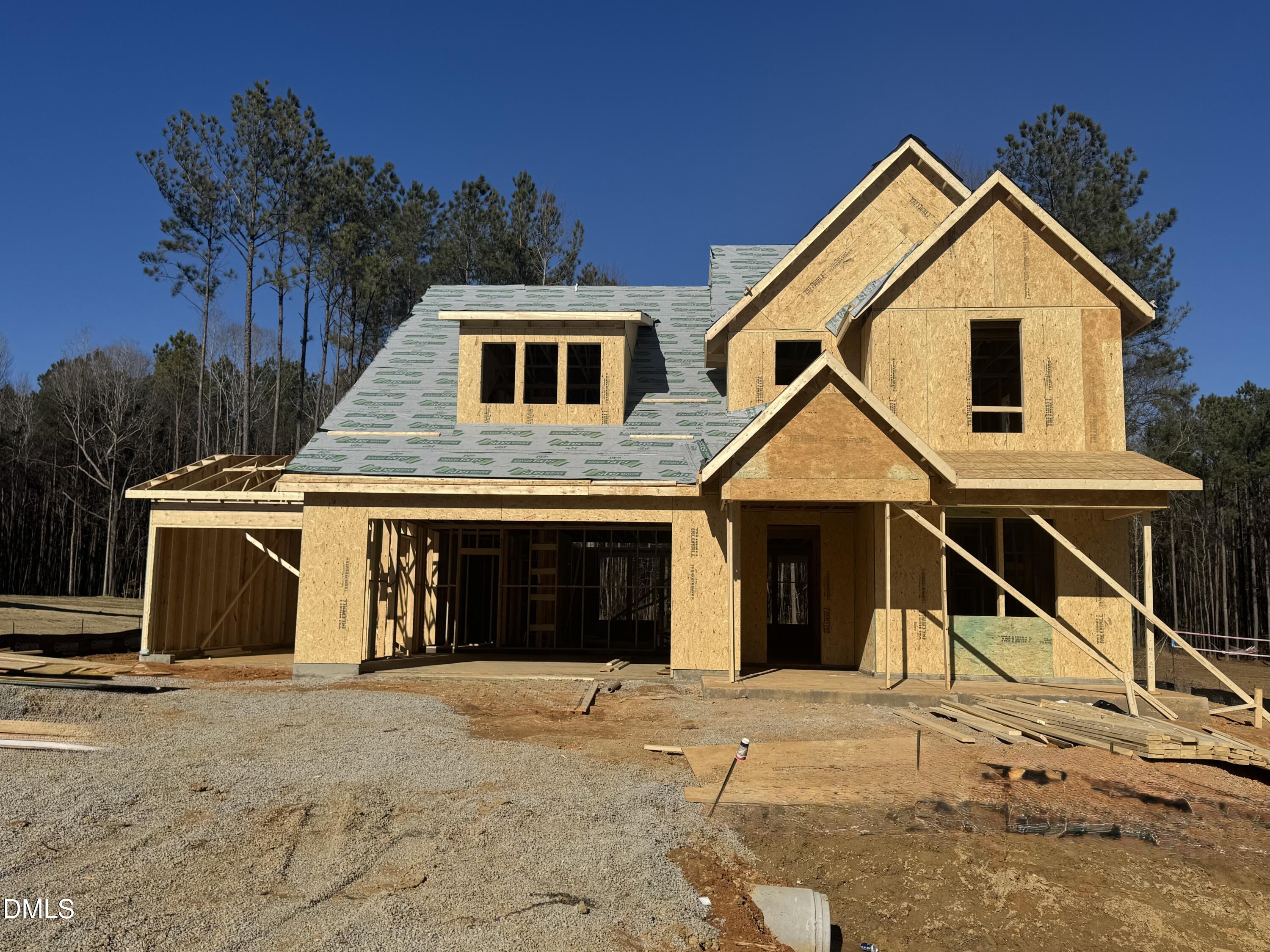 25 West Victoria Rdg Drive, Unit 15 Selma, NC 27576 - Photo 1 of 35 a front view of a house with a yard and garage