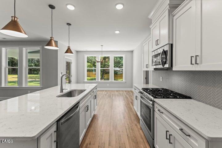 25 West Victoria Rdg Drive, Unit 15 Selma, NC 27576 - Photo 10 of 35 a kitchen with sink stove and window