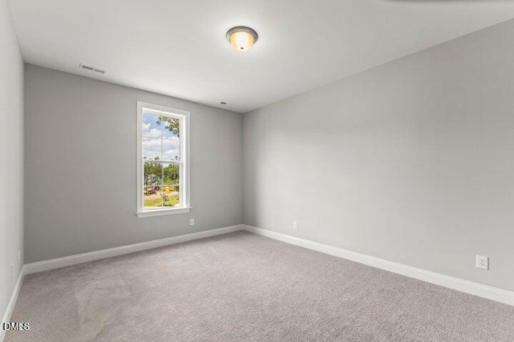 25 West Victoria Rdg Drive, Unit 15 Selma, NC 27576 - Photo 18 of 35 an empty room with a window