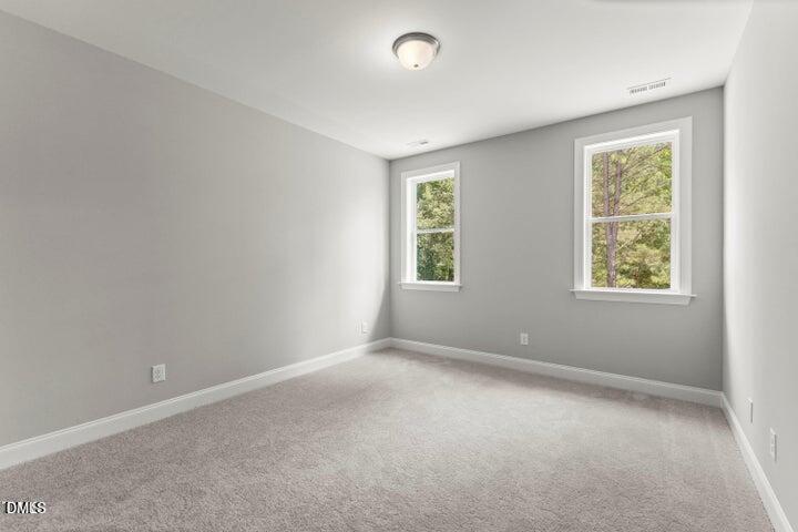 25 West Victoria Rdg Drive, Unit 15 Selma, NC 27576 - Photo 21 of 35 an empty room with windows