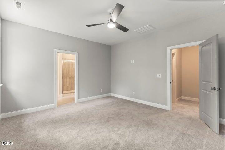 25 West Victoria Rdg Drive, Unit 15 Selma, NC 27576 - Photo 27 of 35 a view of an empty room and a ceiling fan