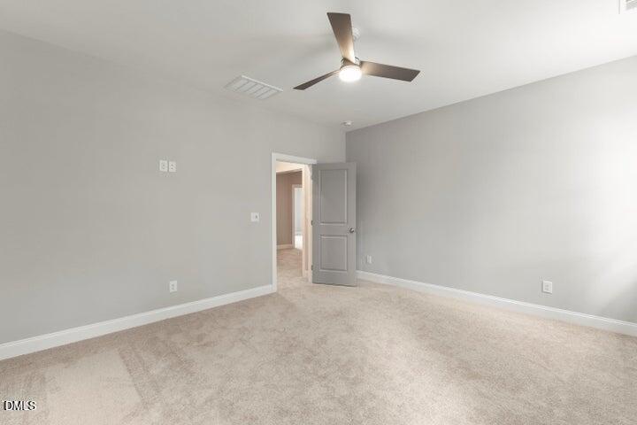 25 West Victoria Rdg Drive, Unit 15 Selma, NC 27576 - Photo 28 of 35 an empty room with chandelier fan