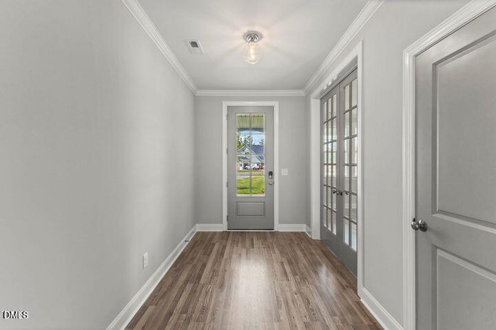 25 West Victoria Rdg Drive, Unit 15 Selma, NC 27576 - Photo 4 of 35 wooden floor in an empty room with a window