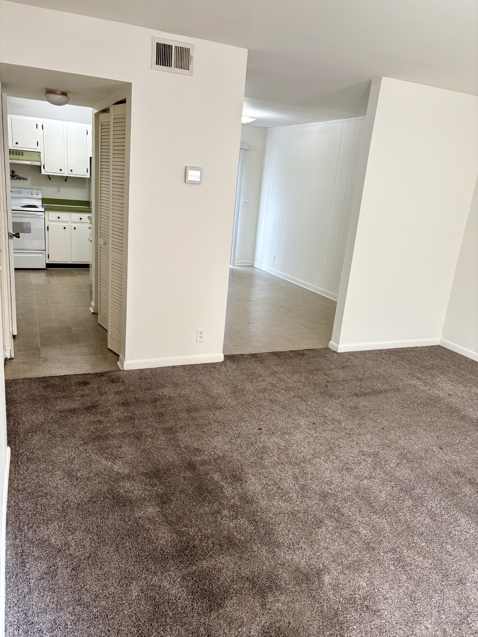 370 Wallace Road, Unit C14 Nashville, TN 37211 - Photo 2 of 8 an empty room with kitchen and a sink