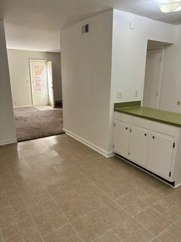 a view of an empty room with a window