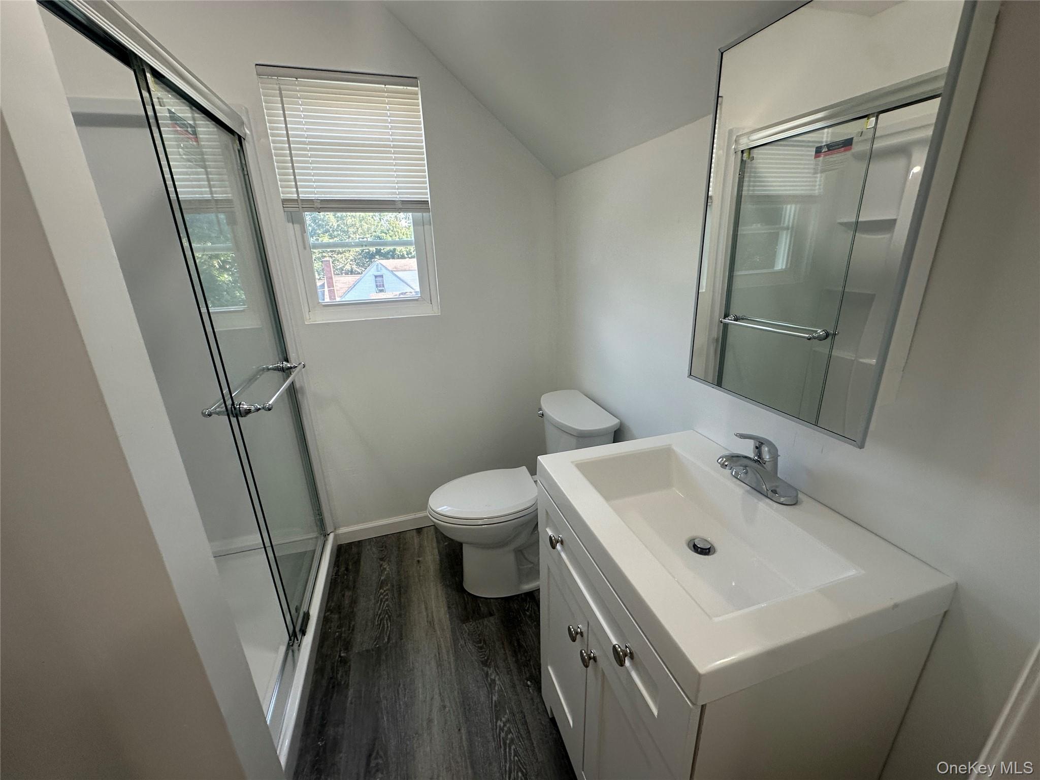 2187 Highway 302, Unit 2 Middletown, NY 10941 - Photo 11 of 13 a bathroom with a sink a toilet and a mirror