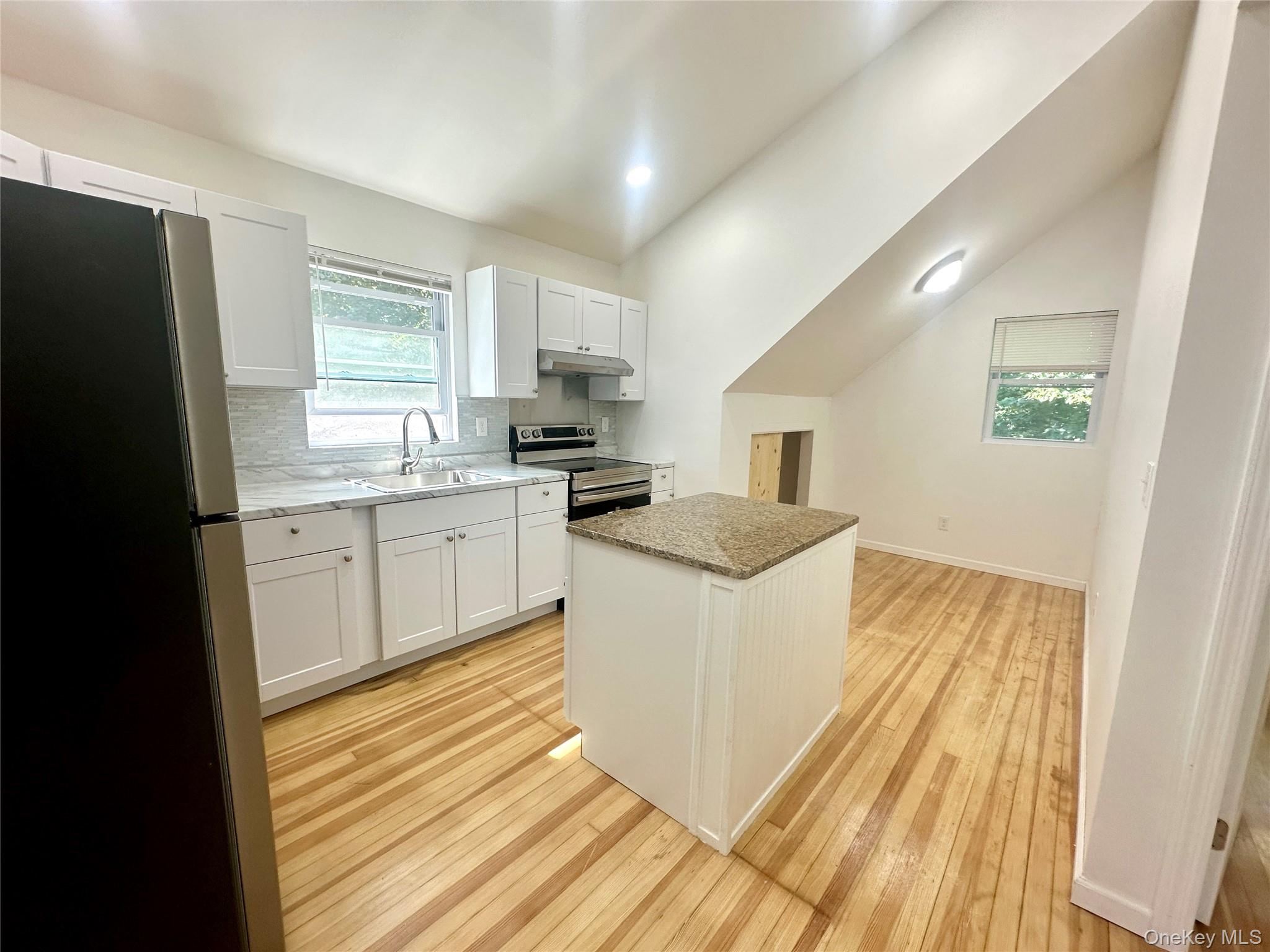 2187 Highway 302, Unit 2 Middletown, NY 10941 - Photo 12 of 13 a kitchen with a sink stove and refrigerator
