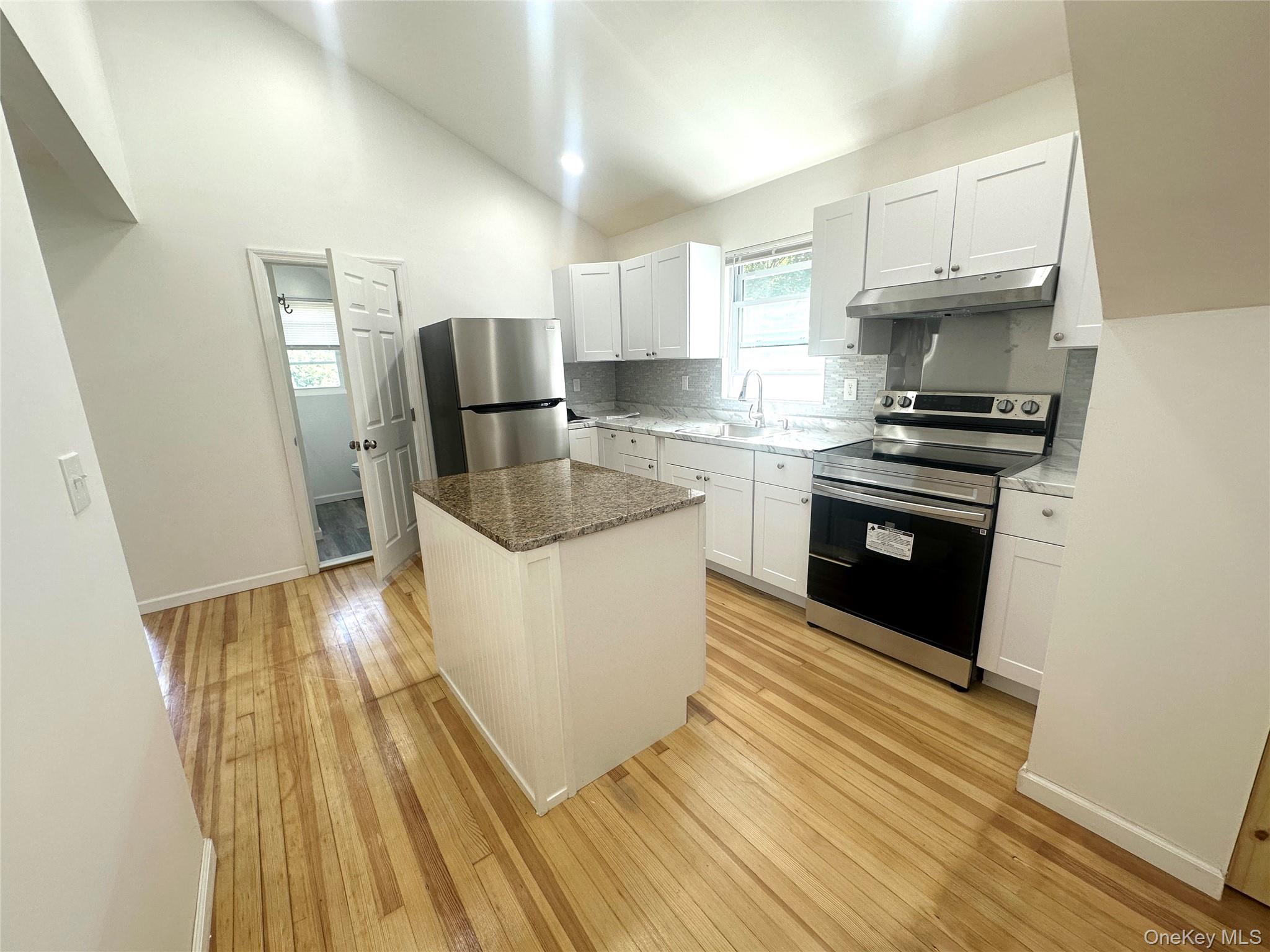 2187 Highway 302, Unit 2 Middletown, NY 10941 - Photo 13 of 13 a kitchen with granite countertop a stove and a sink