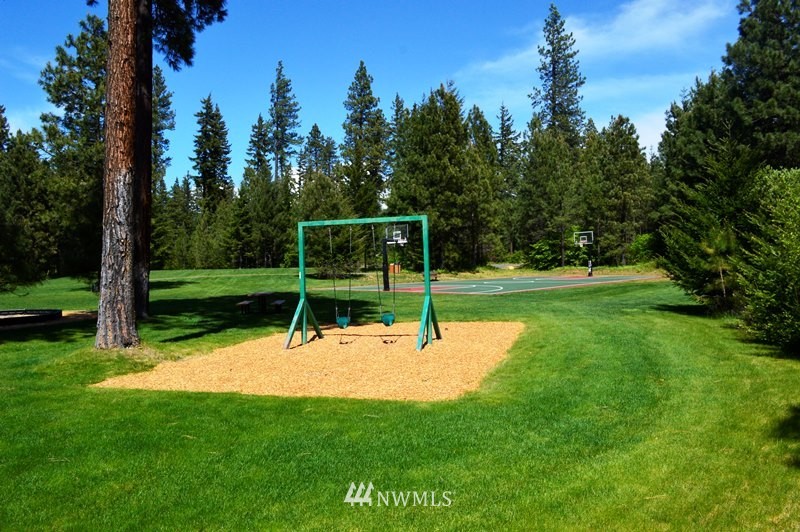 1360 Snowberry Loop Cle Elum, WA 98922 - Photo 10 of 10 a wooden bench sitting in the middle of a park