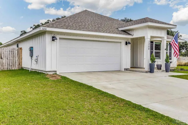 a house view with swimming pool in front of it