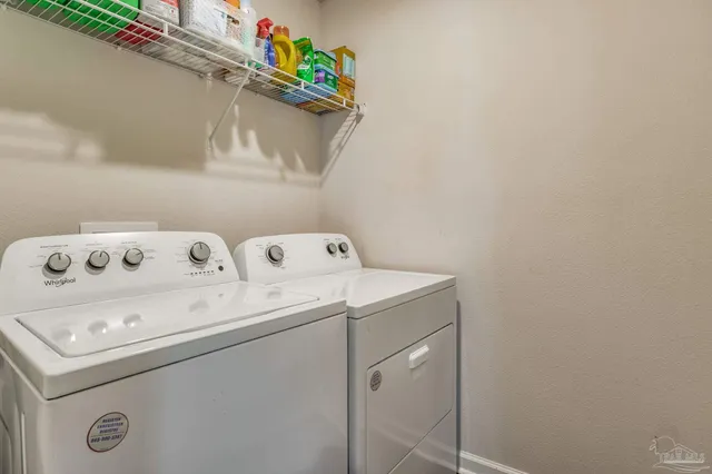 a kitchen with stainless steel appliances granite countertop a sink and a stove with wooden floor