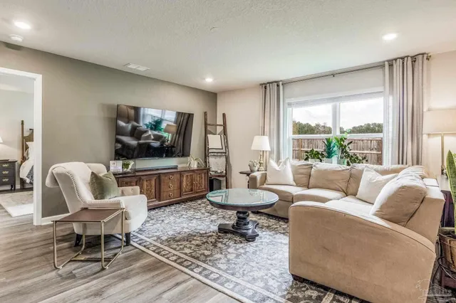 a view of livingroom with hardwood floor and hallway