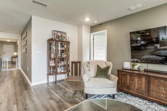 a bedroom with a bed and a flat screen television