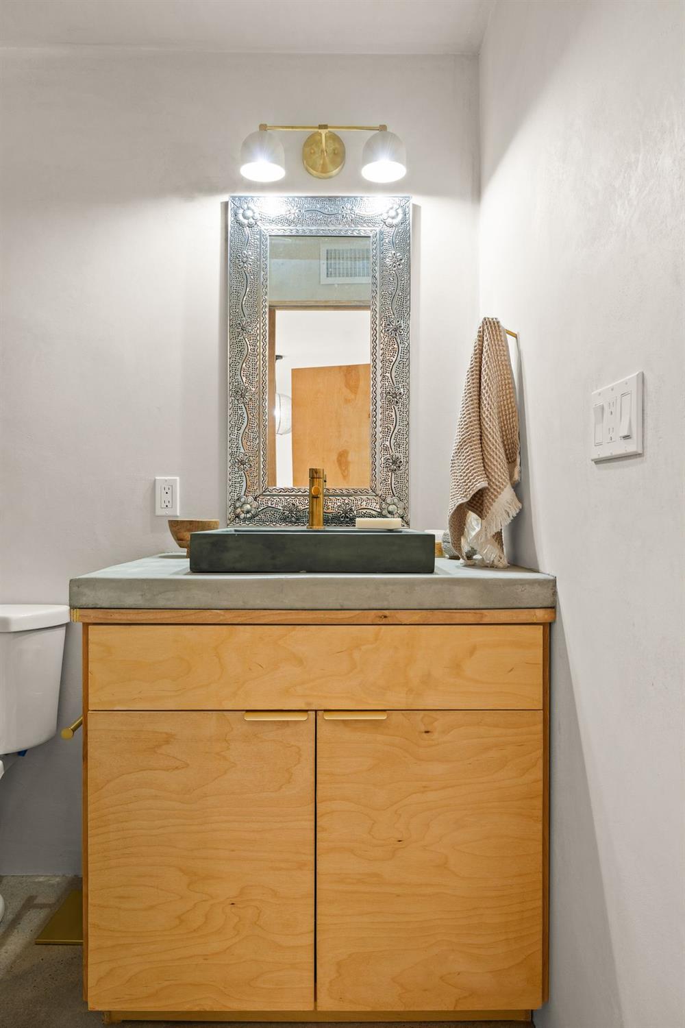 1107 South Rice Road Ojai, CA 93023 - Photo 15 of 24 a bathroom with a sink and a mirror