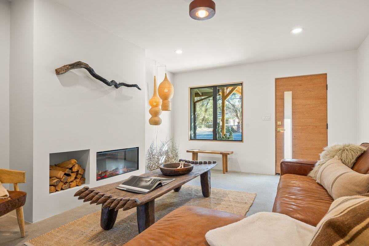 1107 South Rice Road Ojai, CA 93023 - Photo 2 of 24 a living room with furniture and a fireplace