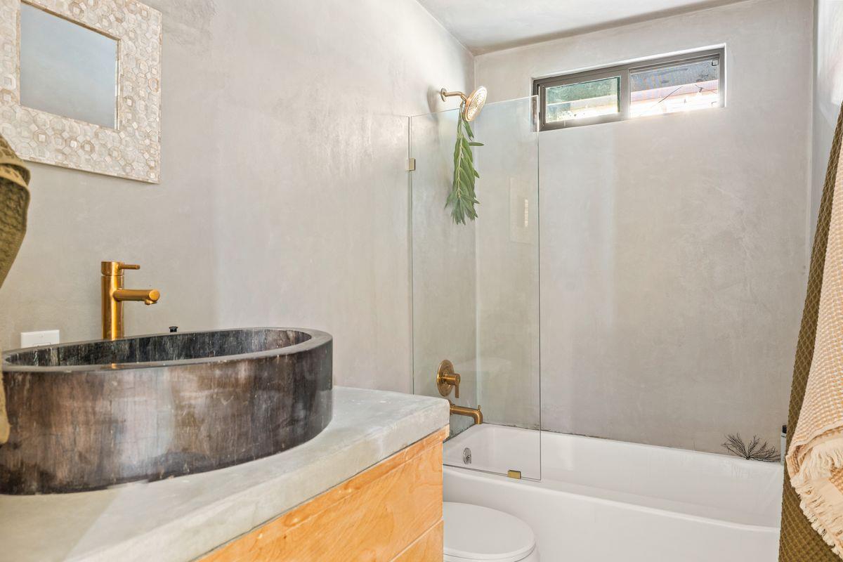 1107 South Rice Road Ojai, CA 93023 - Photo 7 of 24 a bathroom with a tub a sink and a shower