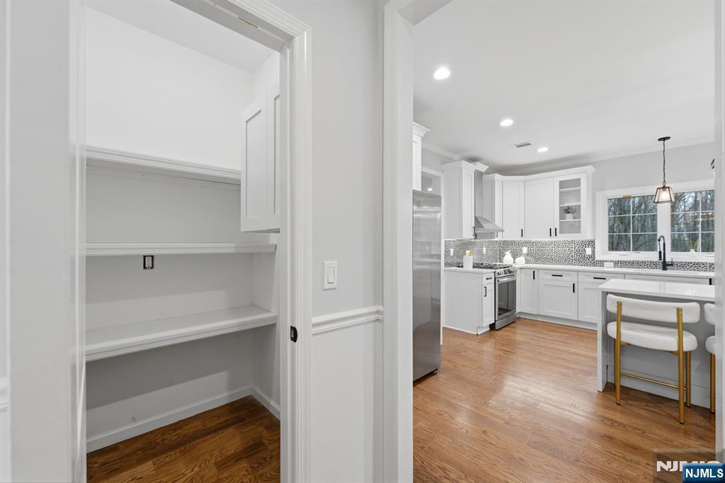 188 Edwards Road Parsippany, NJ 07054 - Photo 12 of 41 a kitchen with white cabinets and white appliances