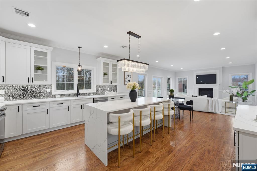 188 Edwards Road Parsippany, NJ 07054 - Photo 13 of 41 a large white kitchen with lots of counter space dining table and chairs