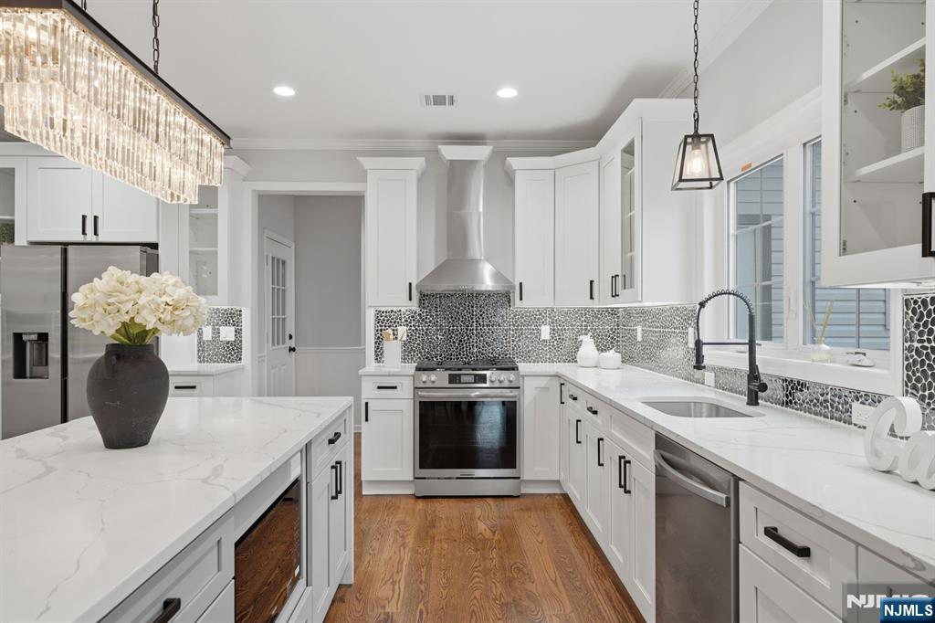 188 Edwards Road Parsippany, NJ 07054 - Photo 14 of 41 a kitchen with stainless steel appliances granite countertop a sink a stove and a refrigerator