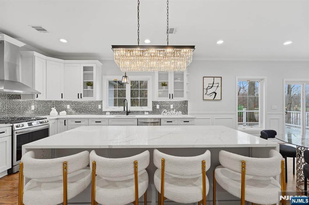 188 Edwards Road Parsippany, NJ 07054 - Photo 15 of 41 a kitchen with a dining table chairs and window