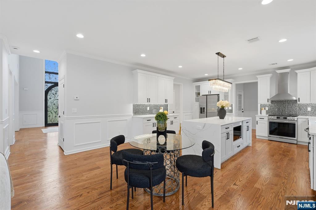 188 Edwards Road Parsippany, NJ 07054 - Photo 16 of 41 a kitchen with granite countertop white cabinets and refrigerator